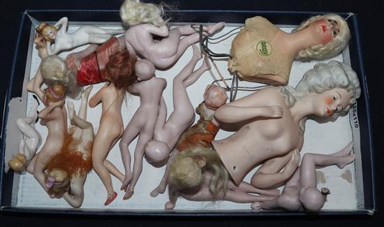 A group of bisque reclining nudes and two busts